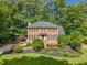 Attractive two-story brick home featuring a lush front yard and inviting curb appeal at 2502 Tritt Springs Ne Trce, Marietta, GA 30062