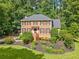 Beautiful two-story brick home showcasing a well-kept lawn and established landscaping at 2502 Tritt Springs Ne Trce, Marietta, GA 30062