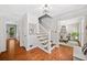 Inviting foyer with hardwood floors, staircase, and views into adjacent rooms at 2502 Tritt Springs Ne Trce, Marietta, GA 30062