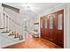 Welcoming foyer with hardwood floors, decorative front door, and elegant details at 2502 Tritt Springs Ne Trce, Marietta, GA 30062