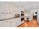 Stylish kitchen featuring white cabinets, stainless steel appliances, and granite countertops at 2502 Tritt Springs Ne Trce, Marietta, GA 30062
