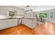 Bright kitchen boasts updated appliances, white cabinets, and eat-in dining area with natural light at 2502 Tritt Springs Ne Trce, Marietta, GA 30062