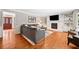 Spacious living room boasts hardwood floors, large sectional, and fireplace with built-in shelving at 2502 Tritt Springs Ne Trce, Marietta, GA 30062