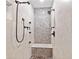 Shower featuring tile walls, mosaic accents, a shower bench, and a rainfall shower head at 2502 Tritt Springs Ne Trce, Marietta, GA 30062