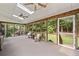 Beautiful sunroom features fans, skylights, wooded views, and seating at 2502 Tritt Springs Ne Trce, Marietta, GA 30062