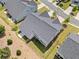 Aerial view of a home showing the backyard, patio, and fenced yard on a sunny day in a suburban neighborhood at 4571 Grenadine Cir, Acworth, GA 30101