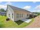 Backyard of the home featuring a small patio and green space at 4571 Grenadine Cir, Acworth, GA 30101