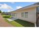Backyard of the home featuring a small patio and green space at 4571 Grenadine Cir, Acworth, GA 30101