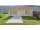 This home features a concrete patio and green backyard space at 4571 Grenadine Cir, Acworth, GA 30101