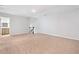 Spacious, carpeted bedroom with stairway and bathroom access at 4571 Grenadine Cir, Acworth, GA 30101