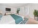 Bright bedroom featuring plush carpet, a large window, and a serene atmosphere at 4571 Grenadine Cir, Acworth, GA 30101
