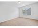 Carpeted bedroom has a window offering plenty of natural light at 4571 Grenadine Cir, Acworth, GA 30101