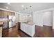 Bright kitchen featuring stainless steel appliances, granite countertops, and center island with sink at 4571 Grenadine Cir, Acworth, GA 30101