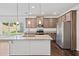 Charming kitchen features granite countertops, stainless steel appliances, and recessed lighting at 4571 Grenadine Cir, Acworth, GA 30101