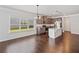 Spacious kitchen with dark wood cabinets, stainless appliances, and eat-in dining area at 4571 Grenadine Cir, Acworth, GA 30101