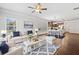 Bright living room featuring hardwood floors, neutral decor, and ample natural light at 4571 Grenadine Cir, Acworth, GA 30101