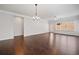 The bright living room showcases hardwood floors, crown molding, and large windows at 4571 Grenadine Cir, Acworth, GA 30101