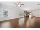 Spacious living area with hardwood floors seamlessly connects to an open kitchen concept at 4571 Grenadine Cir, Acworth, GA 30101