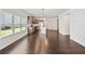 Open concept living area with hardwood flooring connecting the kitchen and living room at 4571 Grenadine Cir, Acworth, GA 30101