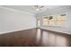 Living room with hardwood floors, large windows, and a glass door leading to the exterior at 4571 Grenadine Cir, Acworth, GA 30101