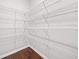 Spacious walk-in closet with multiple shelving units, providing ample storage space at 4571 Grenadine Cir, Acworth, GA 30101