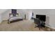 Large bedroom with carpet and an office space, with a bed on one side at 5105 Ashley Falls Ct, Loganville, GA 30052