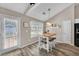 Inviting breakfast nook with a small table, shelves, and an exterior door at 5105 Ashley Falls Ct, Loganville, GA 30052