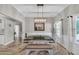 Elegant dining room with modern lighting, neutral tones, and stylish furnishings at 5105 Ashley Falls Ct, Loganville, GA 30052
