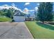 Charming home features a two-car garage, beautifully landscaped front yard and covered front porch with columns at 5105 Ashley Falls Ct, Loganville, GA 30052