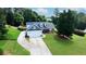 Charming home features a two-car garage, beautifully landscaped front yard and covered front porch with columns at 5105 Ashley Falls Ct, Loganville, GA 30052