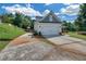 Charming two-story home with a two-car garage, well-maintained driveway, and landscaped lawn at 5105 Ashley Falls Ct, Loganville, GA 30052