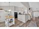 Bright kitchen featuring a breakfast bar, stainless steel appliances, and modern lighting at 5105 Ashley Falls Ct, Loganville, GA 30052