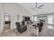 Inviting living room with a fireplace, a ceiling fan, and an open floor plan at 5105 Ashley Falls Ct, Loganville, GA 30052