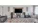 Comfortable living room featuring a media center, speakers, and stylish decor at 5105 Ashley Falls Ct, Loganville, GA 30052