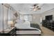 Bright bedroom featuring a ceiling fan, neutral walls, and plush carpeting at 5105 Ashley Falls Ct, Loganville, GA 30052