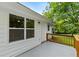 Charming back porch with wooden railing offers a serene outdoor space at 1179 Chatham Rd, Buford, GA 30518
