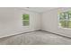 Bright bedroom with two windows offering views of the trees at 1179 Chatham Rd, Buford, GA 30518
