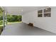 Covered carport boasts ample space, natural light, and a functional design, perfect for vehicle parking and outdoor access at 1179 Chatham Rd, Buford, GA 30518