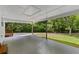 Spacious carport featuring a covered area with natural light and ample space for parking, connecting seamlessly to the outdoors at 1179 Chatham Rd, Buford, GA 30518