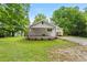 Welcoming facade with a covered porch, landscaped greenery and a side carport adding charm to this beautiful home at 1179 Chatham Rd, Buford, GA 30518