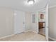 A hallway offers access to the kitchen, where wood cabinets and appliances are visible at 1179 Chatham Rd, Buford, GA 30518