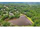 An aerial image showing a pristine lake and houses in a wooded area at 4341 Horder Ct, Snellville, GA 30039