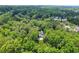 Areal view of a home and a lush wooded neighborhood in a suburban setting at 4341 Horder Ct, Snellville, GA 30039