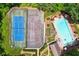 An aerial view features a tennis court and a swimming pool with clear blue water at 4341 Horder Ct, Snellville, GA 30039