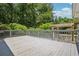 Expansive wooden deck perfect for entertaining, with a pergola and a view of the wooded backyard at 4341 Horder Ct, Snellville, GA 30039