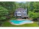 Back of the house featuring a swimming pool and a deck at 4341 Horder Ct, Snellville, GA 30039
