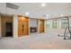 Finished basement features a fireplace, windows, and decorative shelving at 4341 Horder Ct, Snellville, GA 30039