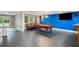 Spacious finished basement featuring a pool table and walk-out doors to the exterior at 4341 Horder Ct, Snellville, GA 30039