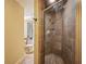Bathroom stall with ceramic tile and shower fixtures at 4341 Horder Ct, Snellville, GA 30039