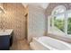 Spacious bathroom with soaking tub, shower, and double vanity at 4341 Horder Ct, Snellville, GA 30039